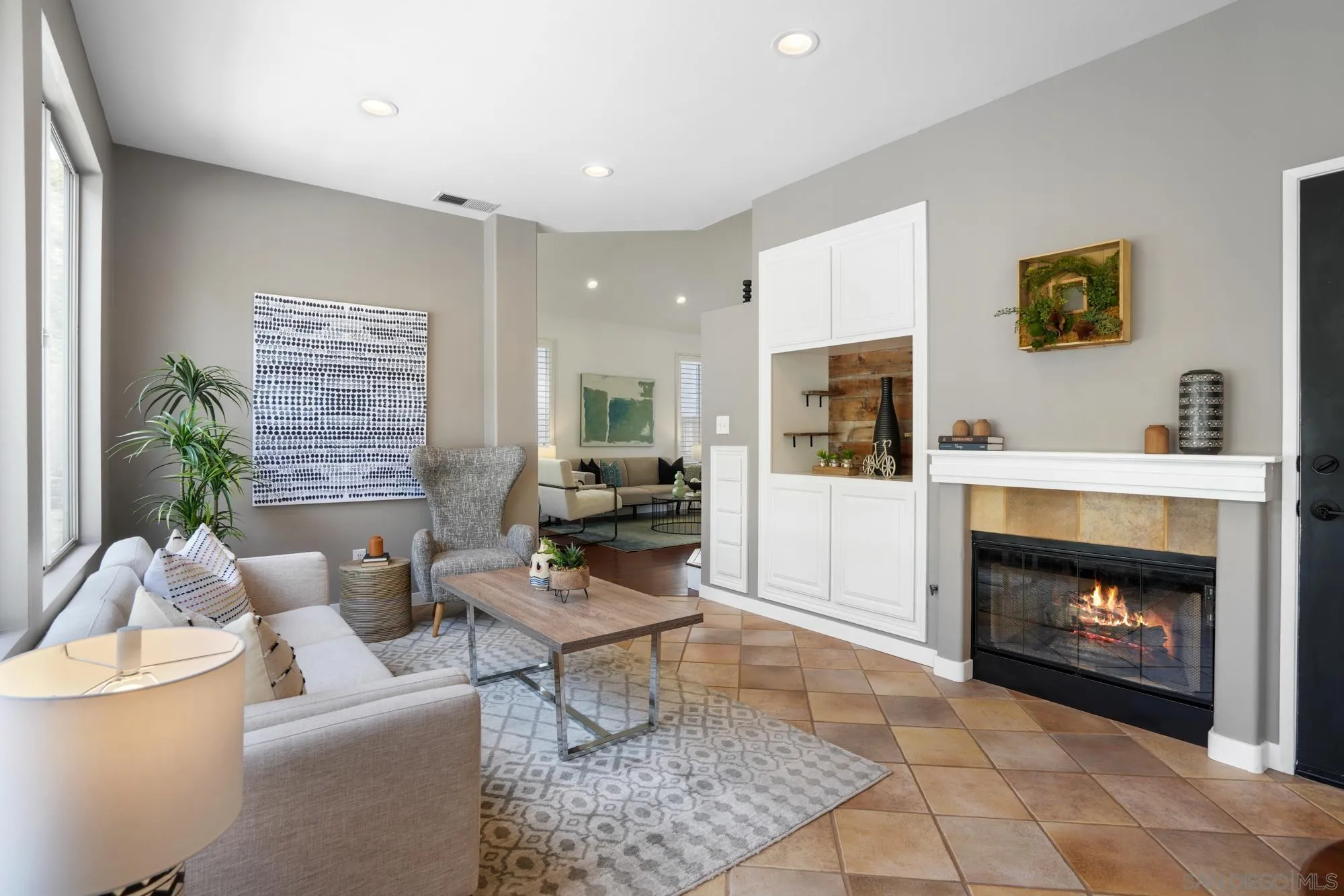 1137 Pacifica Place Encinitas, CA 92024 - Photo 11 of 31 a living room with furniture and a fireplace