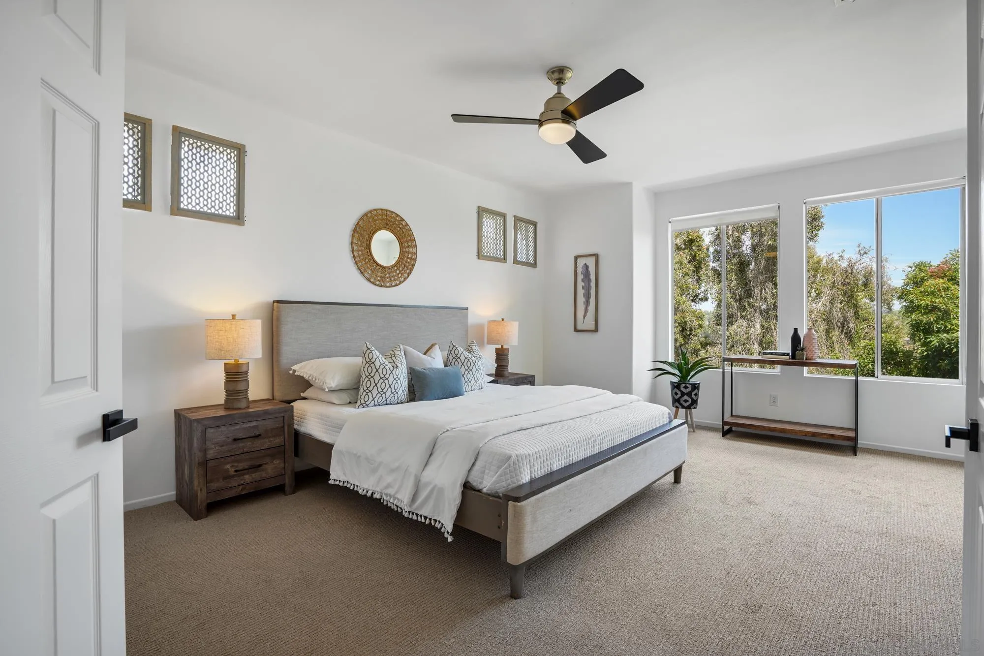 1137 Pacifica Place Encinitas, CA 92024 - Photo 20 of 31 a bedroom with a bed and a large window