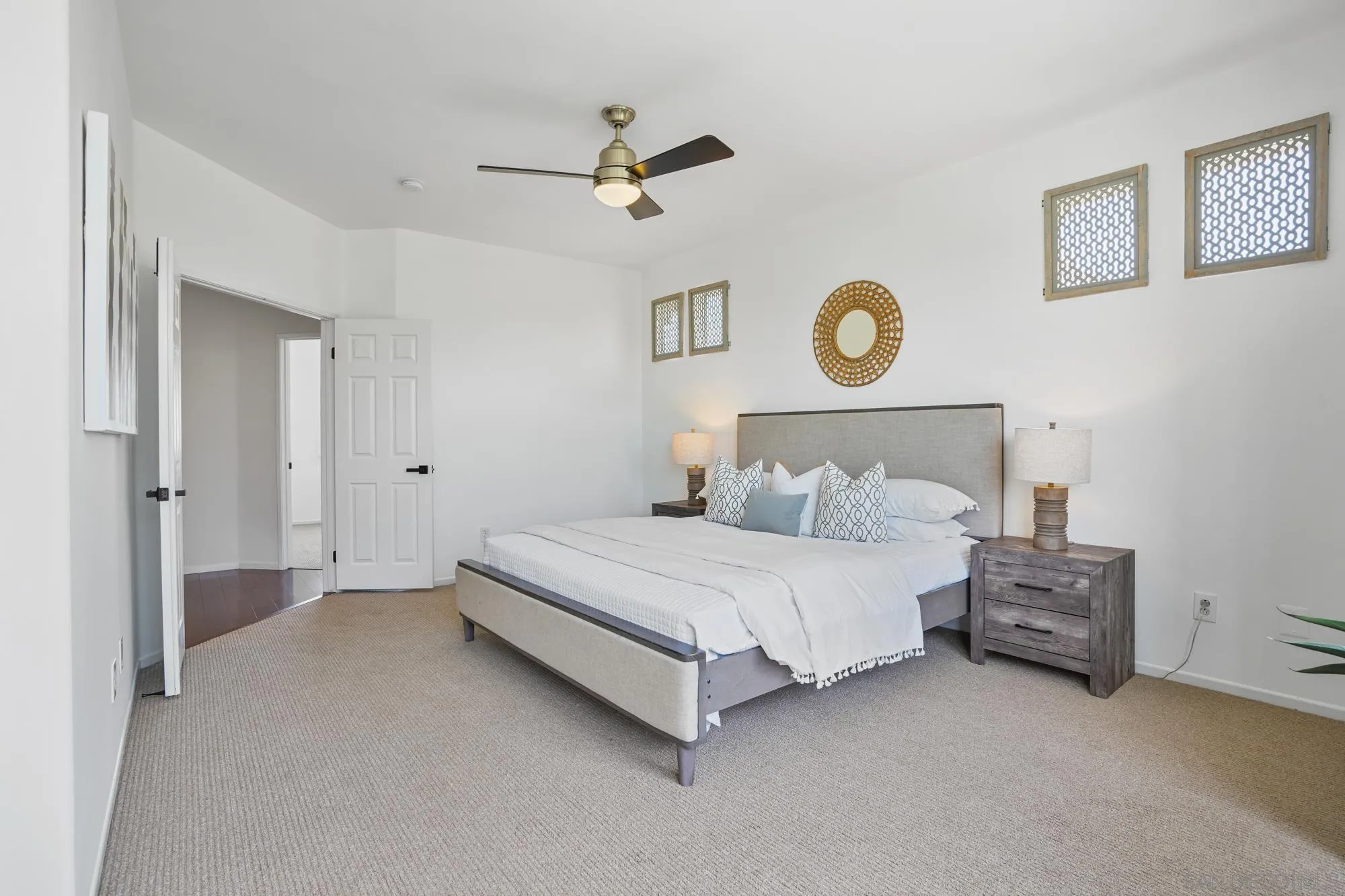 1137 Pacifica Place Encinitas, CA 92024 - Photo 21 of 31 a bedroom with a bed and a chandelier