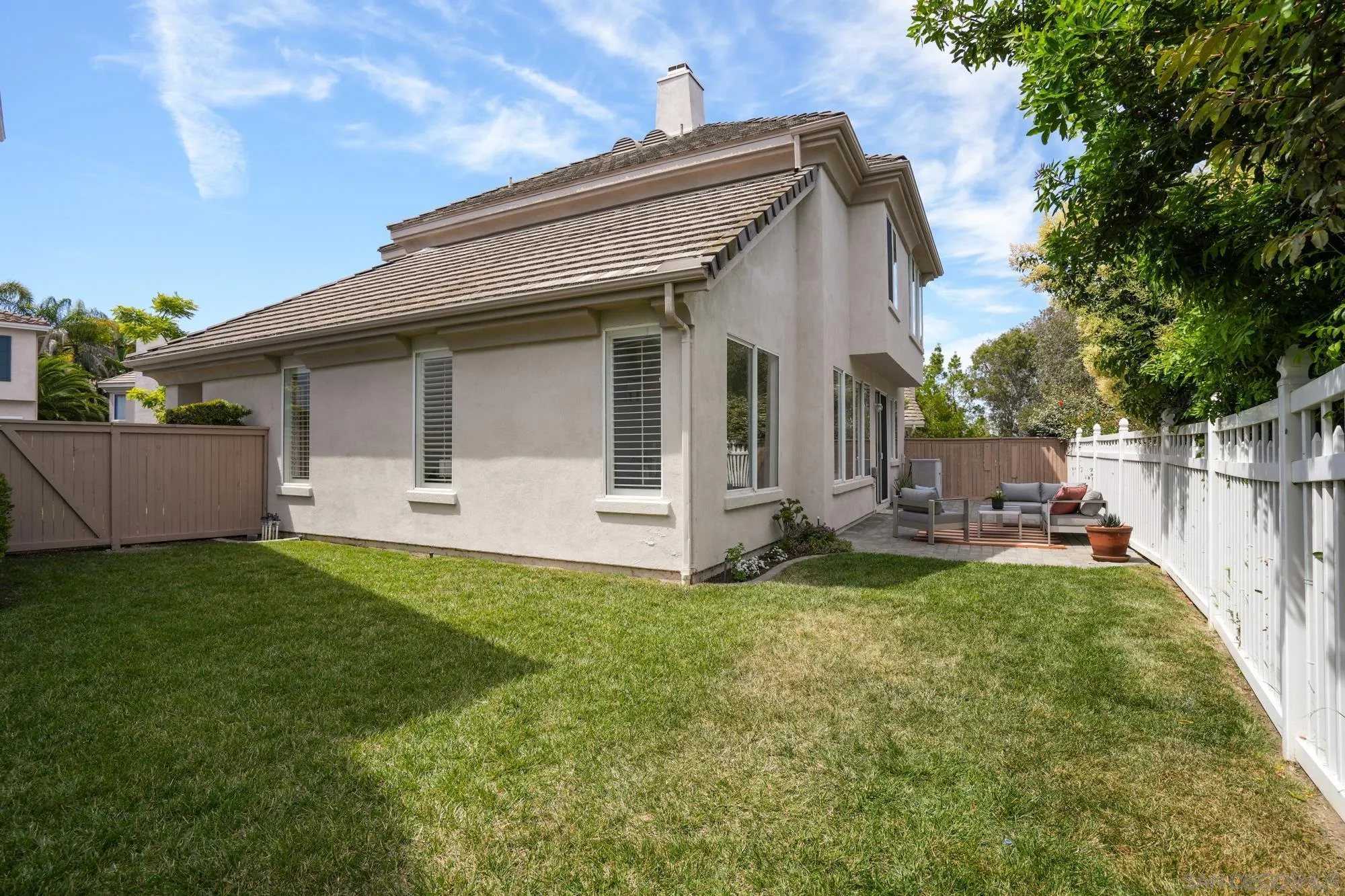 1137 Pacifica Place Encinitas, CA 92024 - Photo 25 of 31 a view of a house with backyard and garden