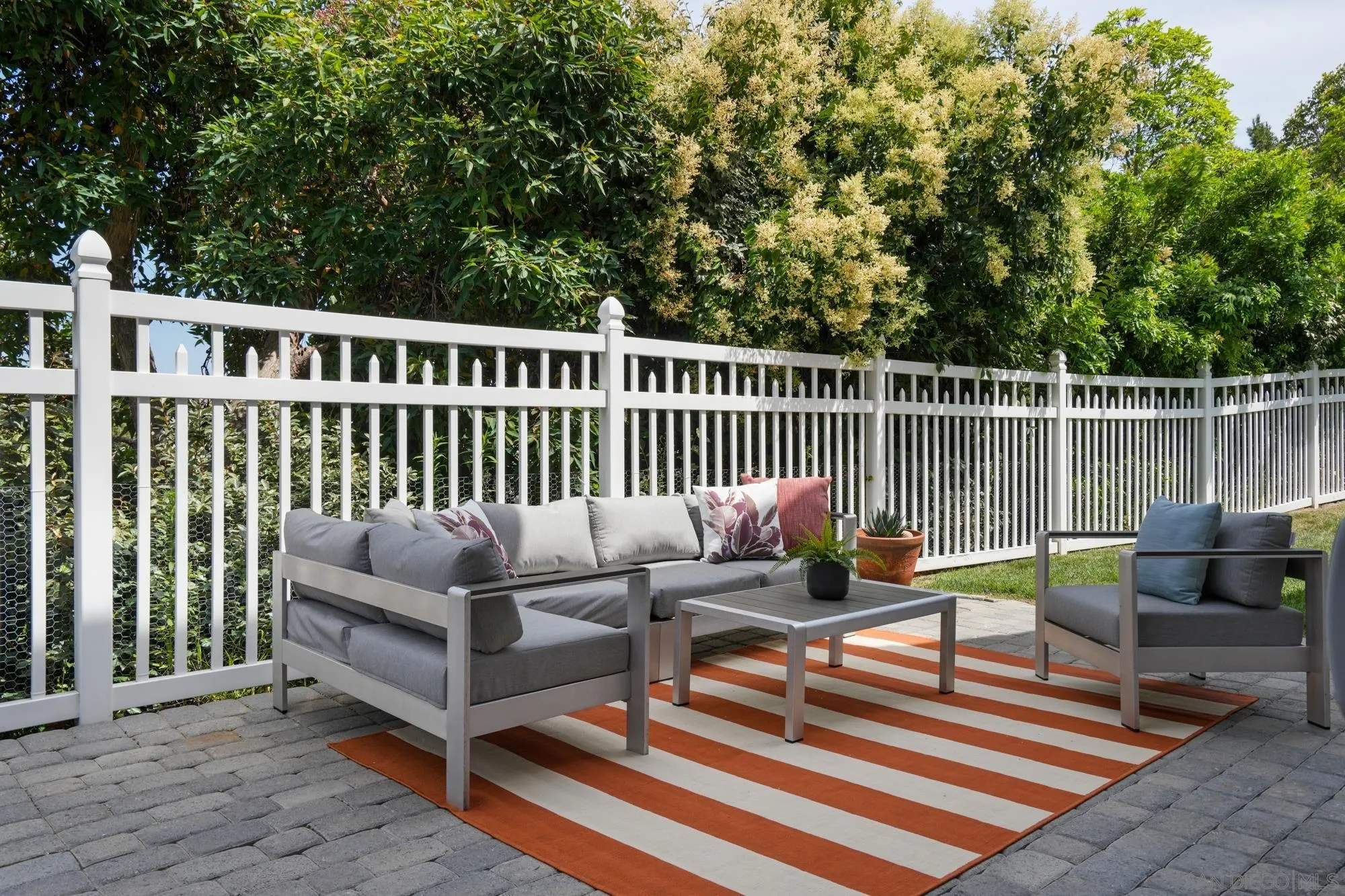 1137 Pacifica Place Encinitas, CA 92024 - Photo 27 of 31 a roof deck with couches and wooden floor