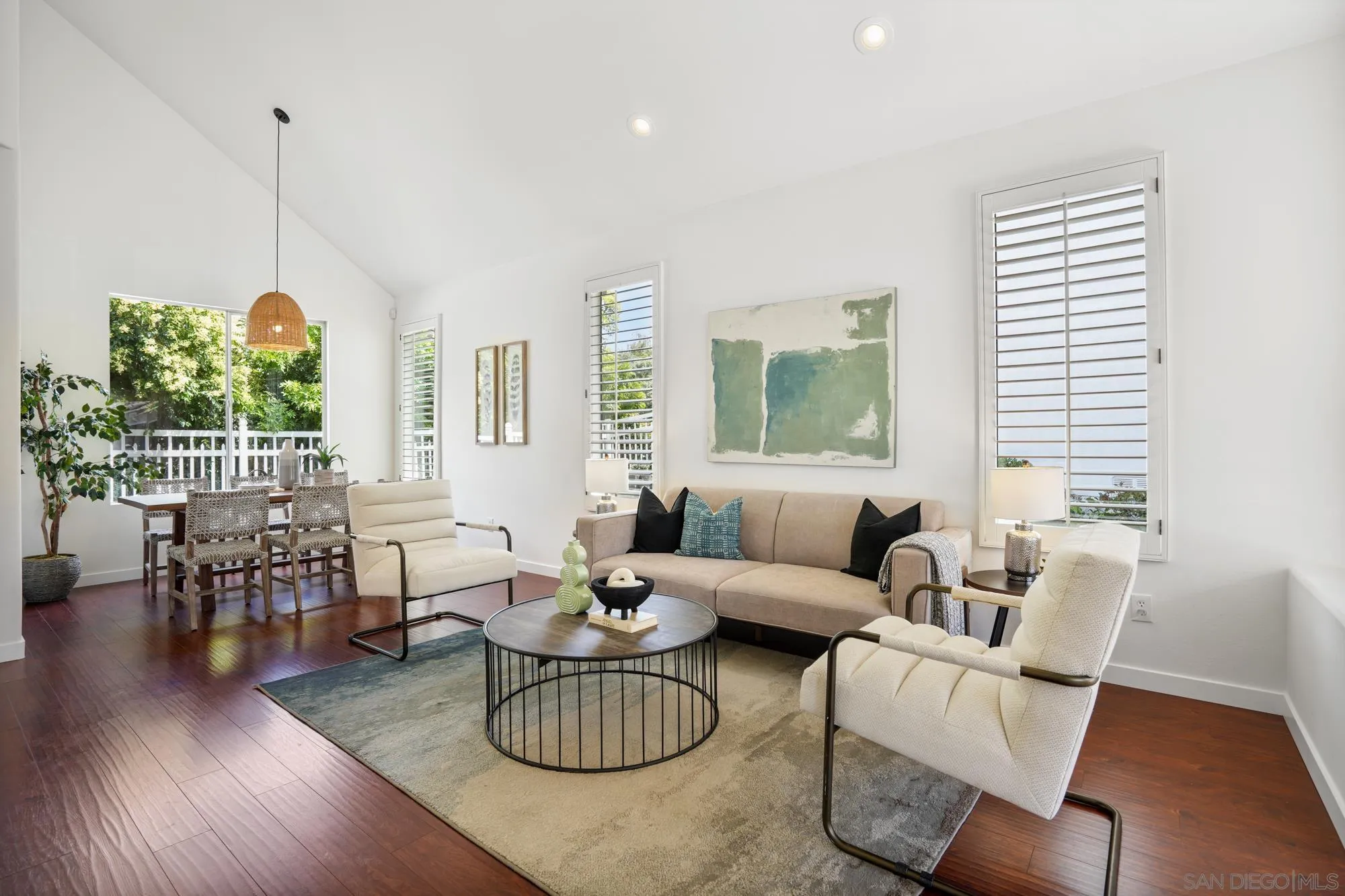 1137 Pacifica Place Encinitas, CA 92024 - Photo 5 of 31 a living room with furniture dining table and a large window