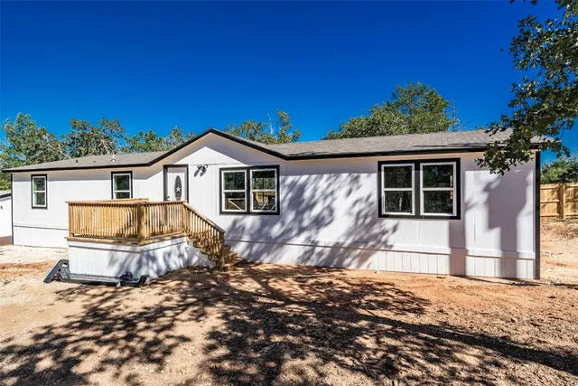 a view of a kitchen with a sink and cabinets