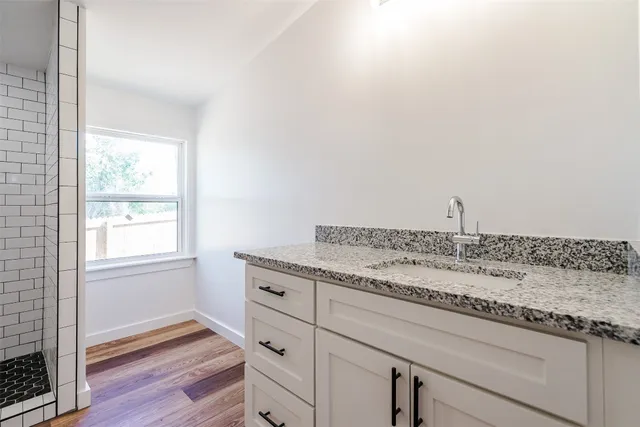a utility room with cabinets washer and dryer