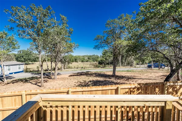 a view of a yard with trees