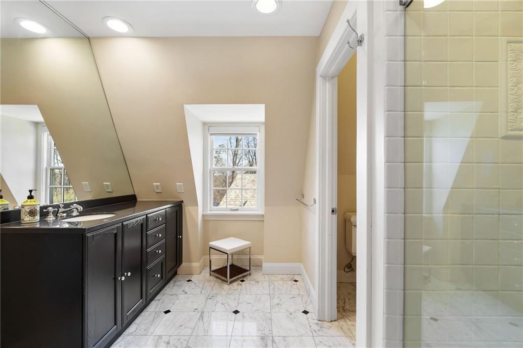 265 Scaife Road Sewickley, PA 15143 - Photo 41 of 48 a bathroom with a sink a toilet and shower