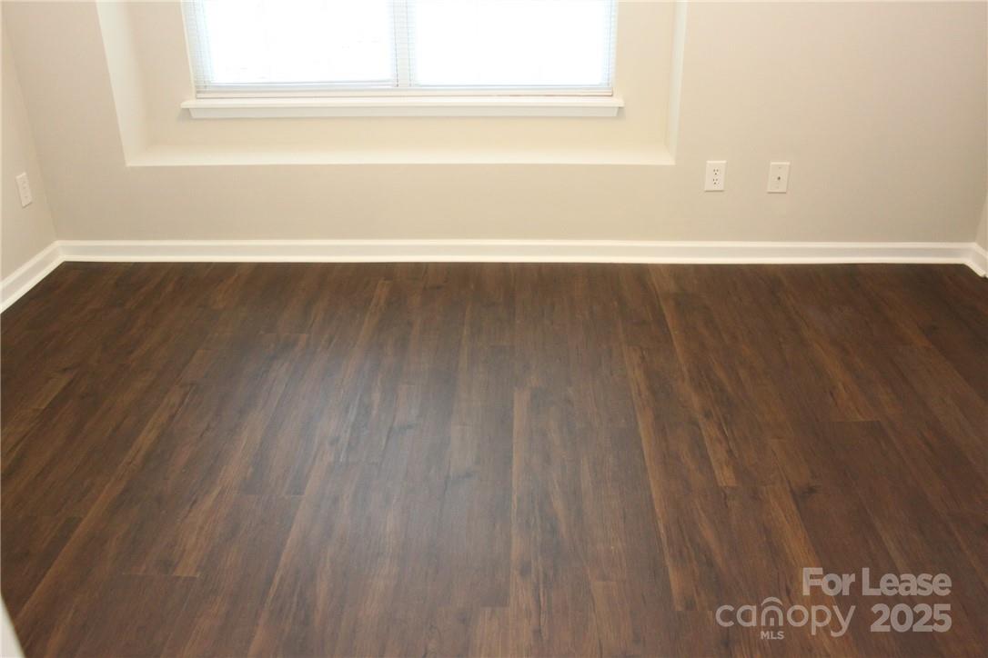 17013 Turning Stick Court Charlotte, NC 28213 - Photo 16 of 27 a view of a room with wooden floor and a window