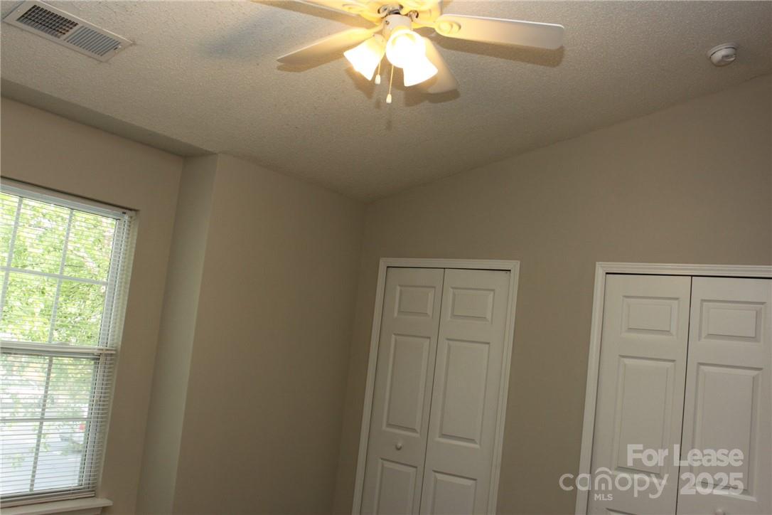 17013 Turning Stick Court Charlotte, NC 28213 - Photo 18 of 27 a front door view with a chandelier fan