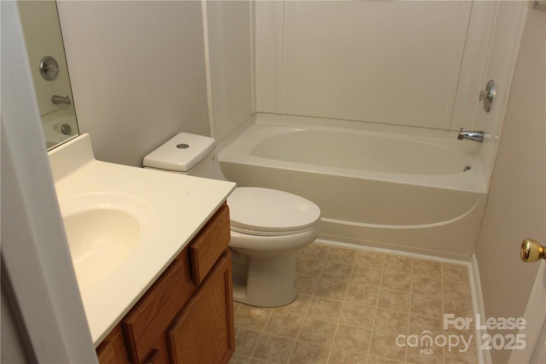 17013 Turning Stick Court Charlotte, NC 28213 - Photo 22 of 27 a bathroom with a toilet and a tub