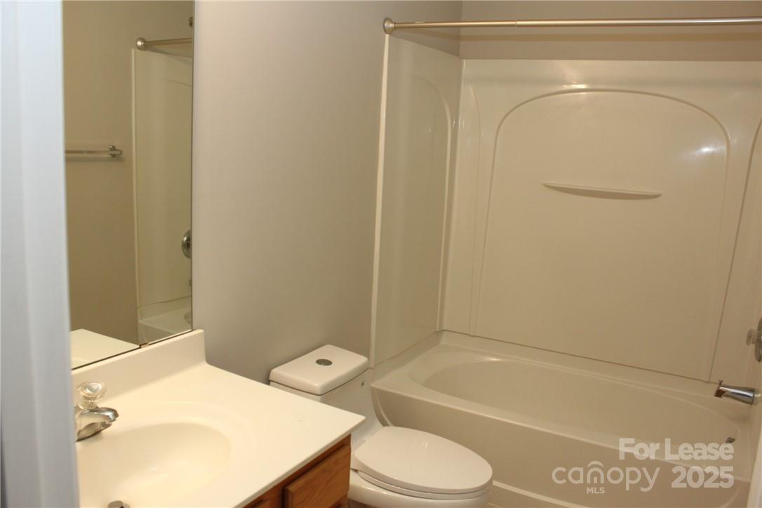 17013 Turning Stick Court Charlotte, NC 28213 - Photo 23 of 27 a bathroom with a sink a toilet and shower