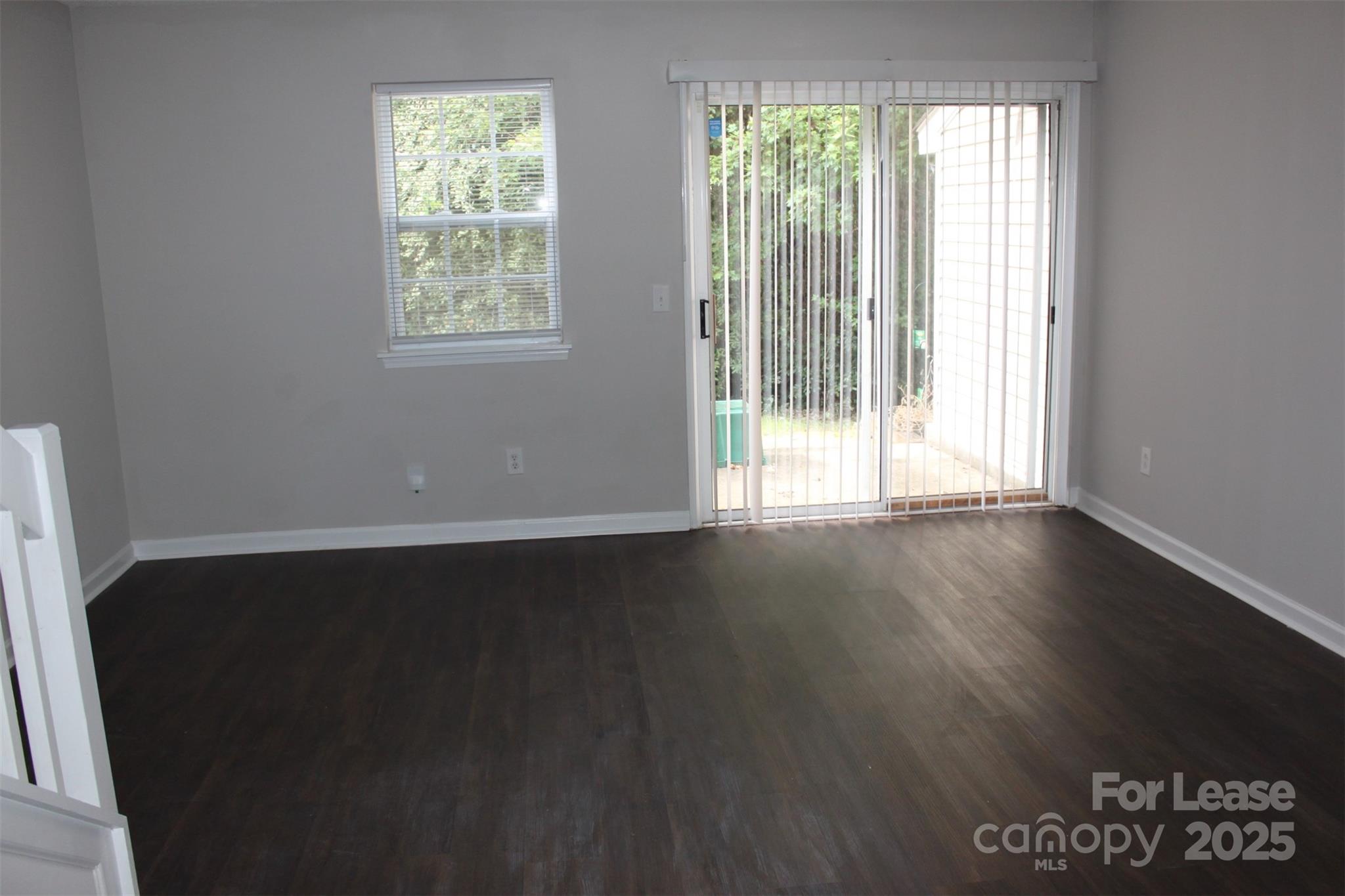17013 Turning Stick Court Charlotte, NC 28213 - Photo 5 of 27 an empty room with wooden floor and windows
