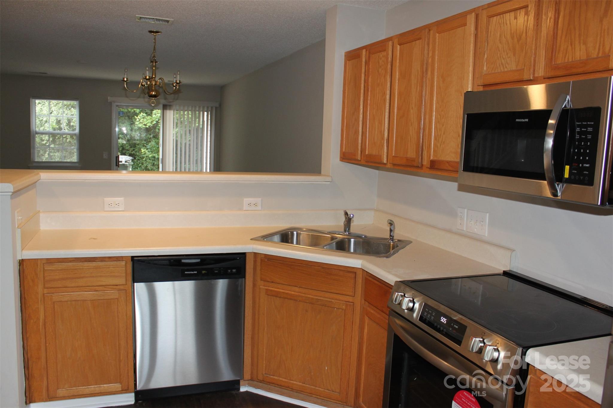 17013 Turning Stick Court Charlotte, NC 28213 - Photo 6 of 27 a kitchen with a sink and cabinets