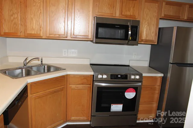 a kitchen with a stove and a microwave