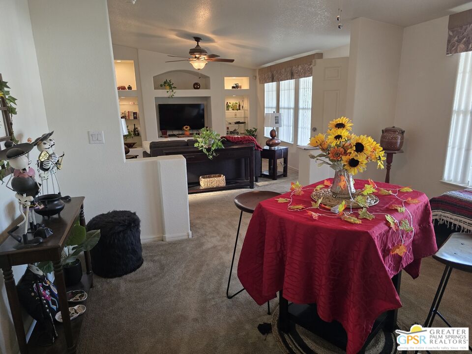 26012 Chelsea Way Hemet, CA 92544 - Photo 11 of 27 a bed room with furniture and a fireplace