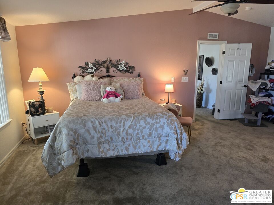 26012 Chelsea Way Hemet, CA 92544 - Photo 12 of 27 a bedroom with a bed and a lamp