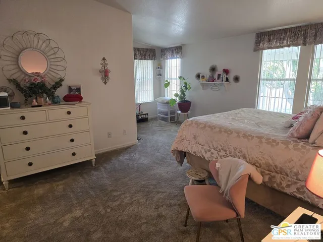 a bed room with a bed and a couch