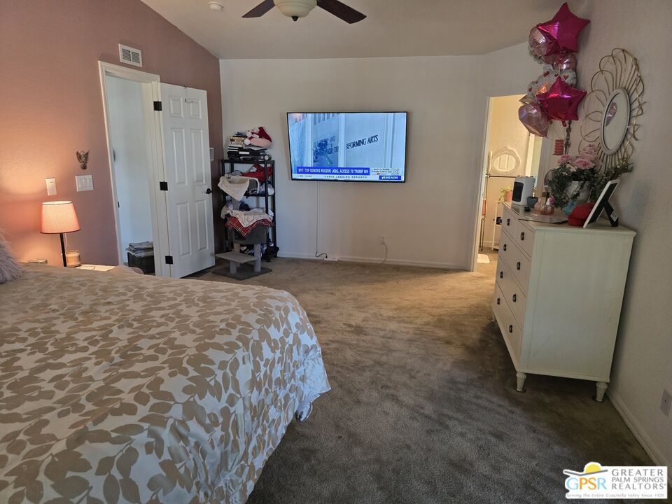 26012 Chelsea Way Hemet, CA 92544 - Photo 14 of 27 a bed room with a bed and a couch