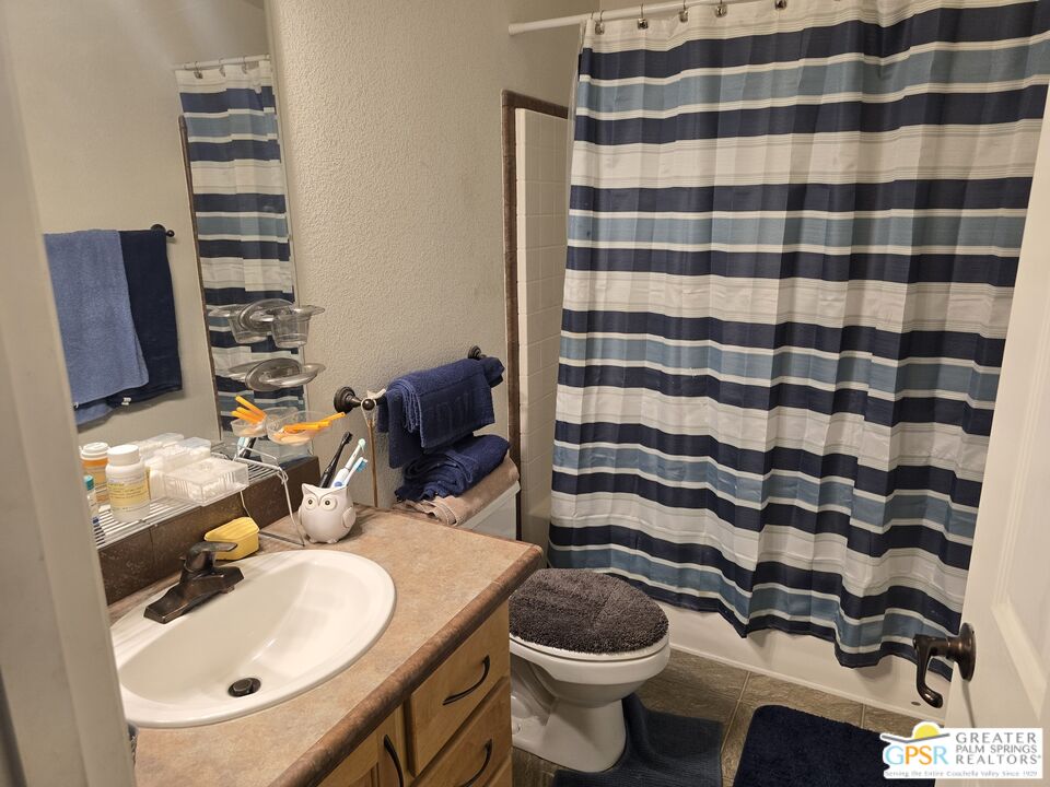 26012 Chelsea Way Hemet, CA 92544 - Photo 20 of 27 a bathroom with a sink toilet and shower