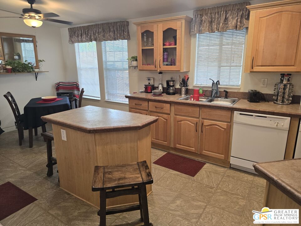 26012 Chelsea Way Hemet, CA 92544 - Photo 6 of 27 a kitchen with a sink cabinets and window