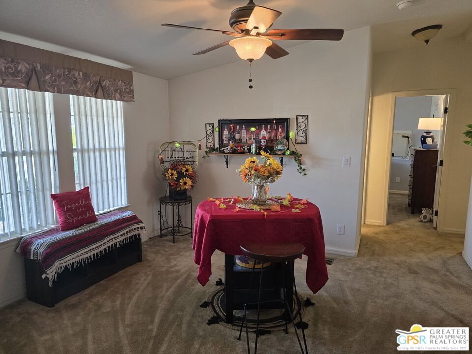 26012 Chelsea Way Hemet, CA 92544 - Photo 10 of 27 a bedroom with a bed and a chandelier