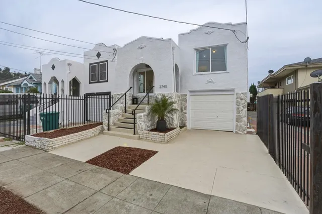 a kitchen with a stove sink and cabinets