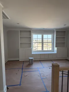 a bathroom with a granite countertop sink and mirror