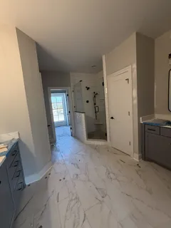 a view of a livingroom with wooden floor and windows