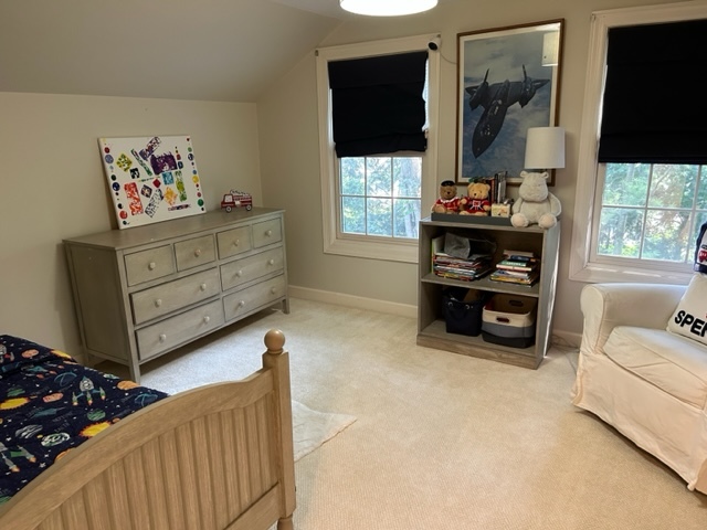 269 Locust Road Winnetka, IL 60093 - Photo 19 of 26 a living room with furniture a flat screen tv and a window