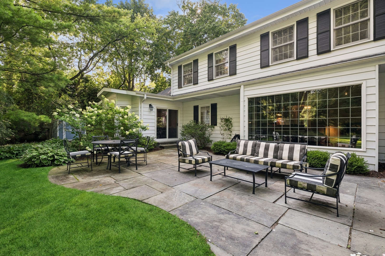 269 Locust Road Winnetka, IL 60093 - Photo 23 of 26 a view of a house with patio in the backyard