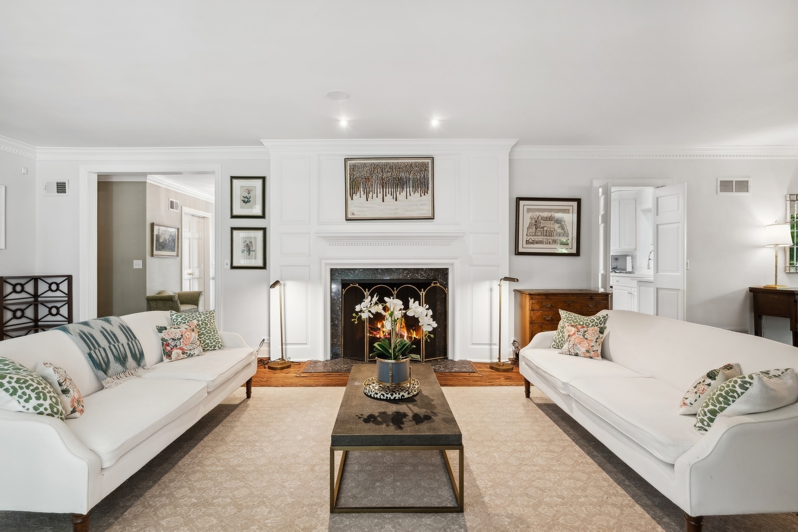 269 Locust Road Winnetka, IL 60093 - Photo 3 of 26 a living room with furniture and a fireplace