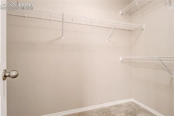a view of a room with racks on the wall