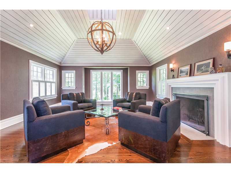 12 Shady Acres Road Darien, CT 06820 - Photo 6 of 8 a living room with furniture ceiling fan and a fireplace