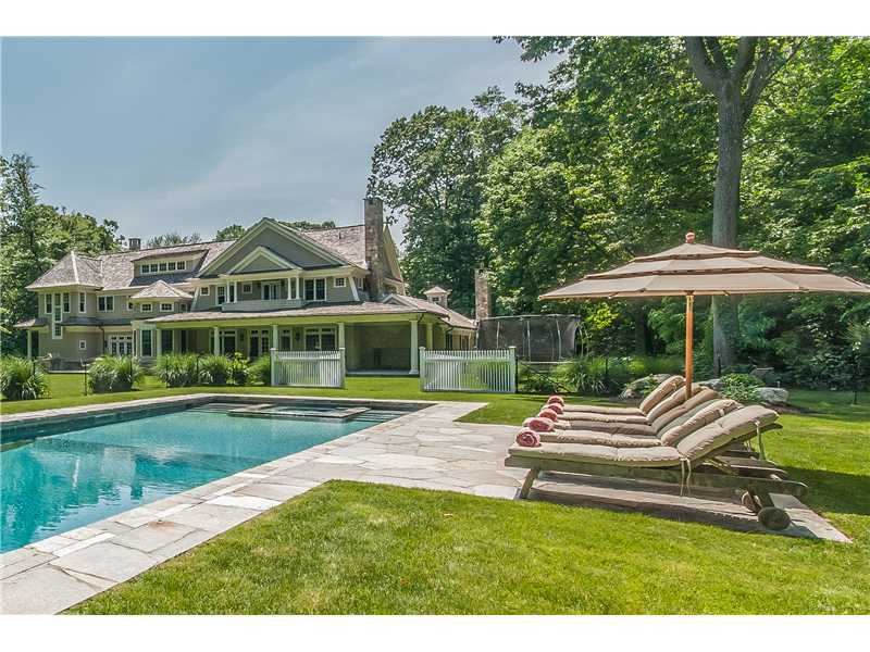 12 Shady Acres Road Darien, CT 06820 - Photo 7 of 8 a view of a house with a yard patio and swimming pool