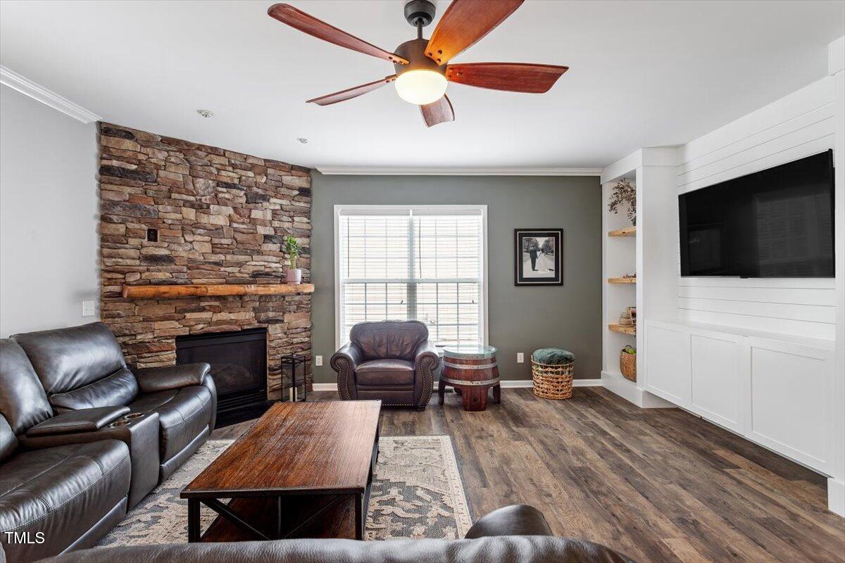 308 Mickleson Ridge Drive Raleigh, NC 27603 - Photo 13 of 51 a living room with furniture fireplace and flat screen tv