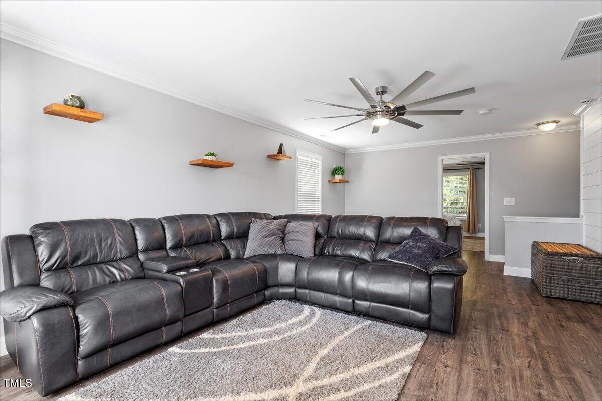 308 Mickleson Ridge Drive Raleigh, NC 27603 - Photo 23 of 51 a living room with furniture and wooden floor