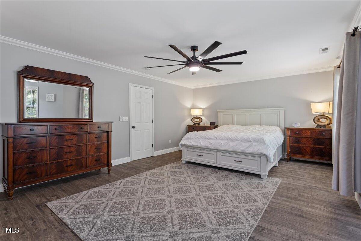 308 Mickleson Ridge Drive Raleigh, NC 27603 - Photo 26 of 51 a bedroom with a bed and a dresser