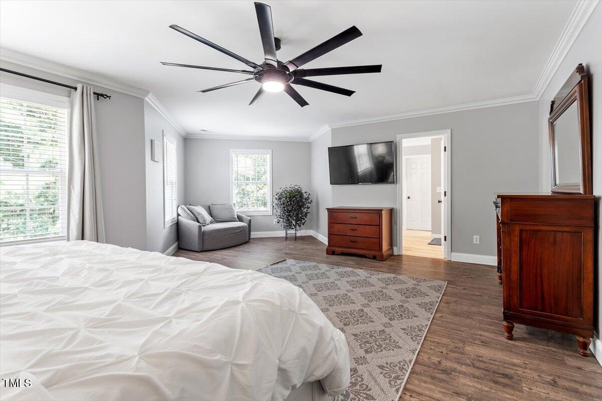 308 Mickleson Ridge Drive Raleigh, NC 27603 - Photo 27 of 51 a bedroom with a bed and a flat screen tv