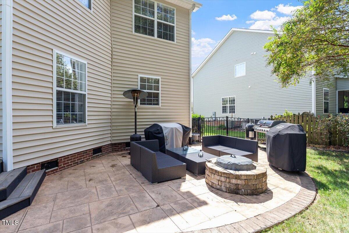 308 Mickleson Ridge Drive Raleigh, NC 27603 - Photo 36 of 51 a backyard of a house with seating space