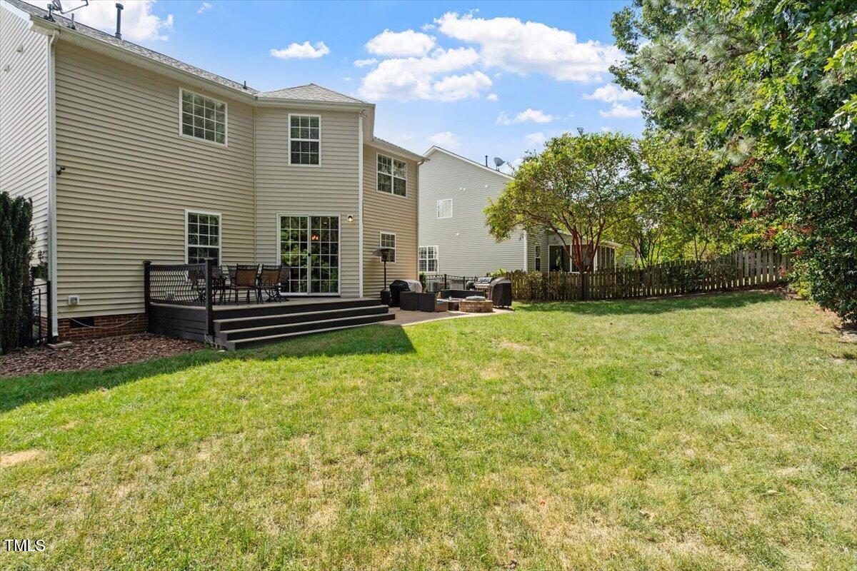 308 Mickleson Ridge Drive Raleigh, NC 27603 - Photo 39 of 51 a view of a house with backyard and sitting area