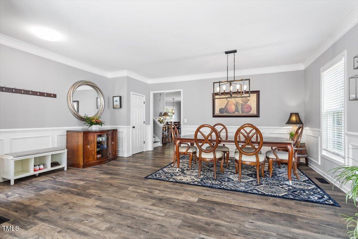 308 Mickleson Ridge Drive Raleigh, NC 27603 - Photo 7 of 51 a view of a a dining room with furniture window and wooden floor