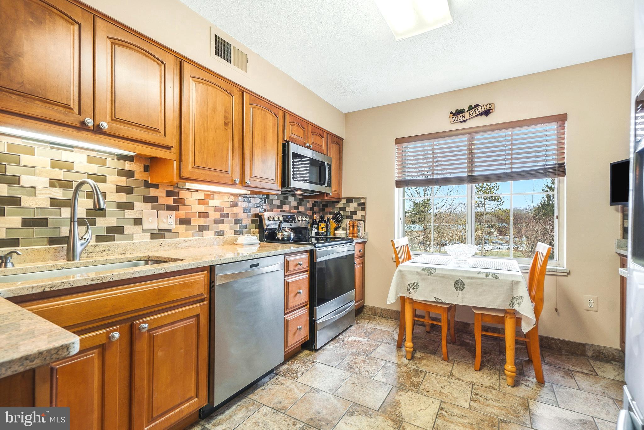 14801 Pennfield Circle, Unit 302 Silver Spring, MD 20906 - Photo 14 of 45 Stainless steel appliances and backsplash
