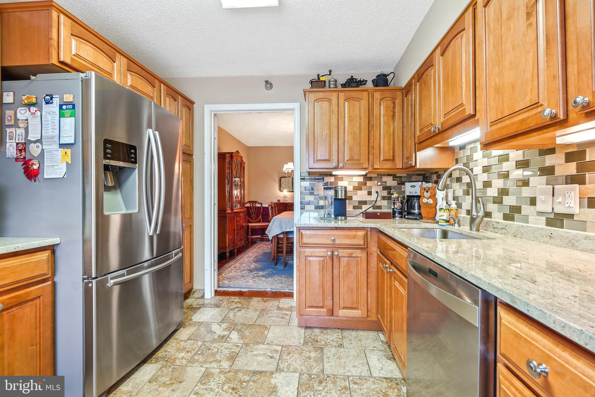 14801 Pennfield Circle, Unit 302 Silver Spring, MD 20906 - Photo 15 of 45 Cafe refrigerator w/ bottom freezer & tile floors