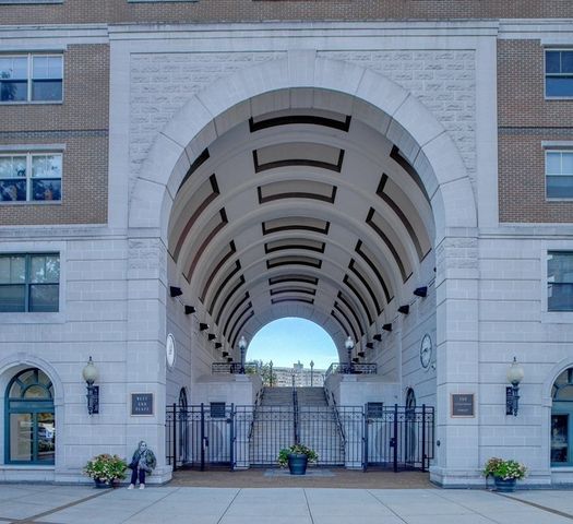 a kitchen with granite countertop a refrigerator sink and stove
