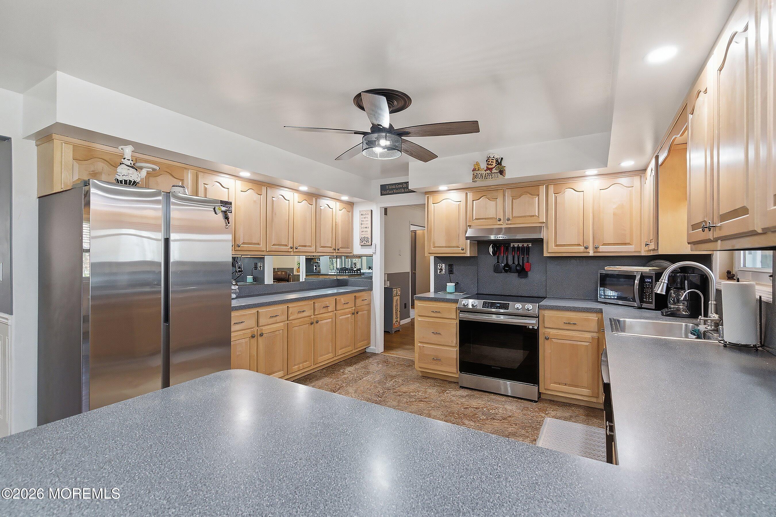151 North Cooks Bridge Road Jackson, NJ 08527 - Photo 11 of 48 a kitchen with granite countertop a refrigerator oven a sink and cabinets