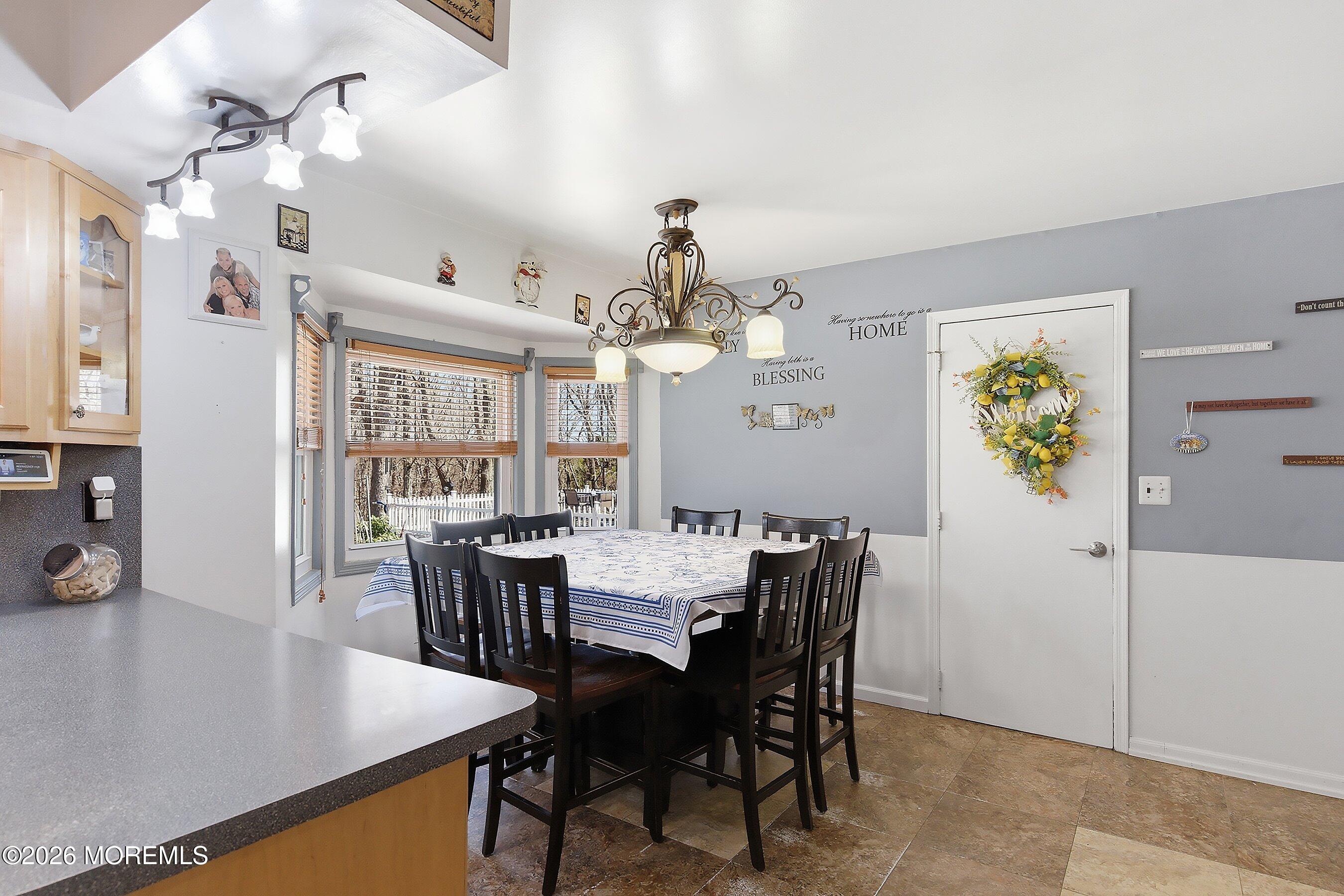 151 North Cooks Bridge Road Jackson, NJ 08527 - Photo 12 of 48 a view of a dining room with furniture and chandelier