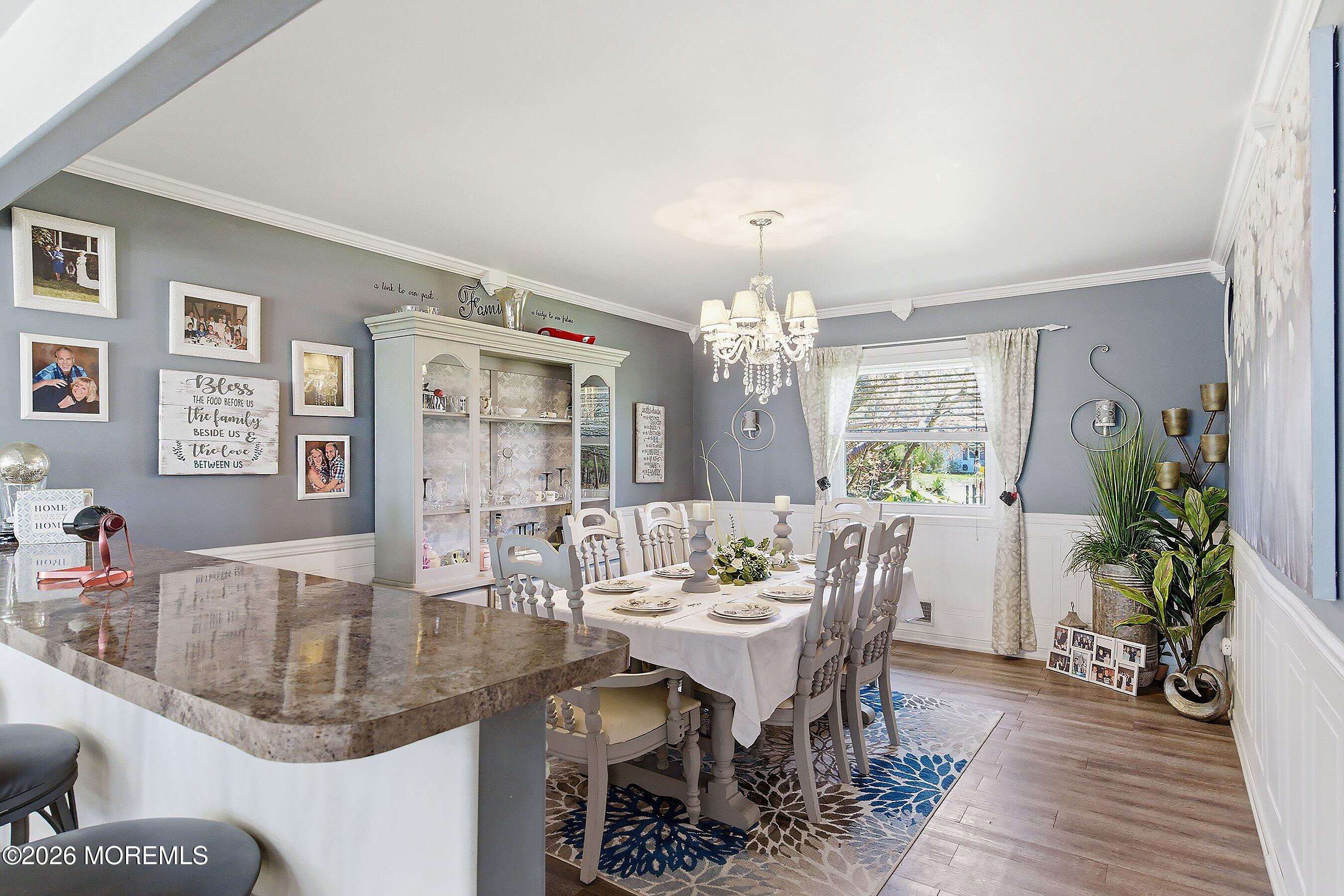 151 North Cooks Bridge Road Jackson, NJ 08527 - Photo 13 of 48 a view of a dining room with furniture a chandelier and wooden floor