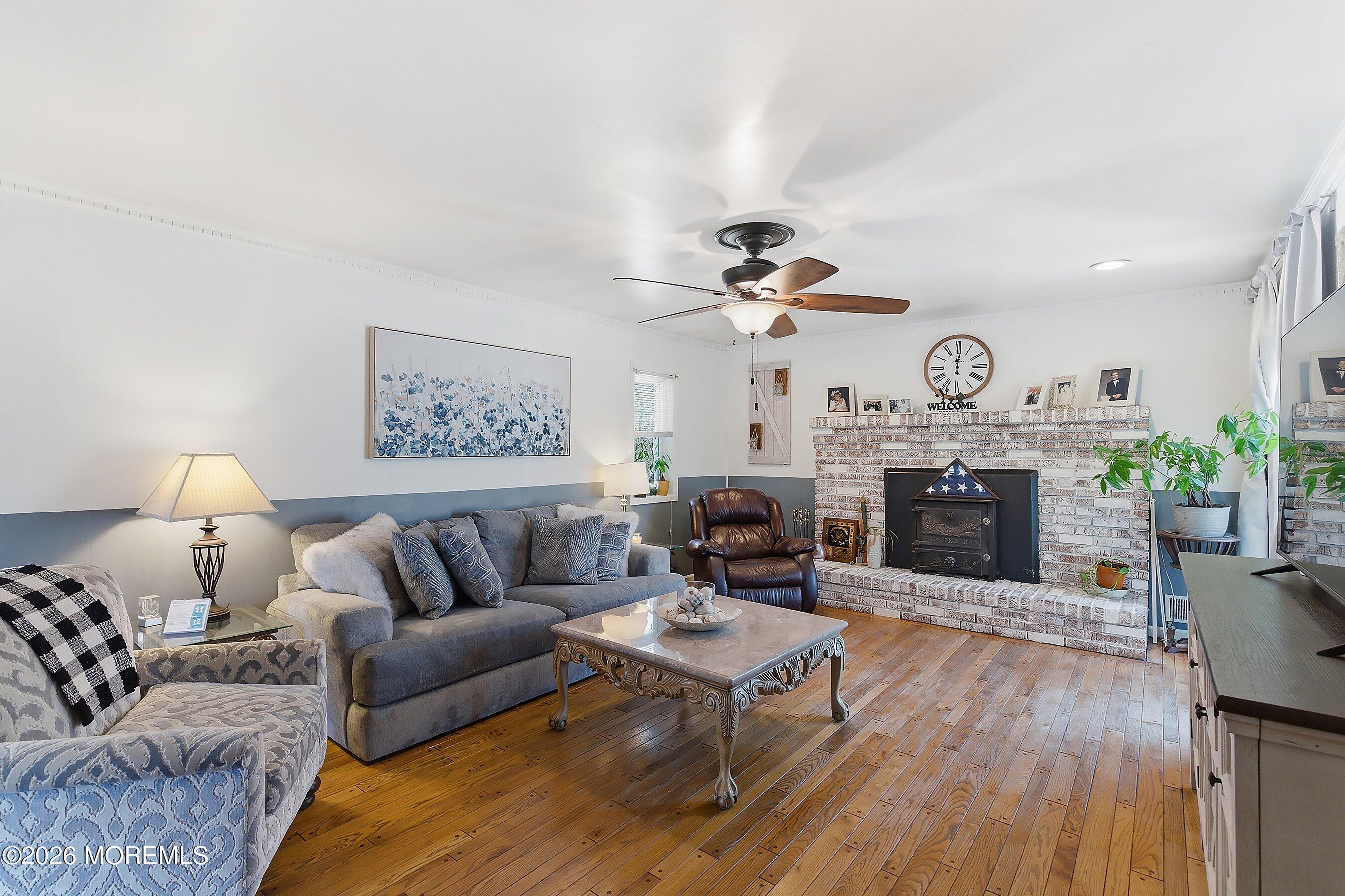 151 North Cooks Bridge Road Jackson, NJ 08527 - Photo 14 of 48 a living room with furniture a fireplace and a table