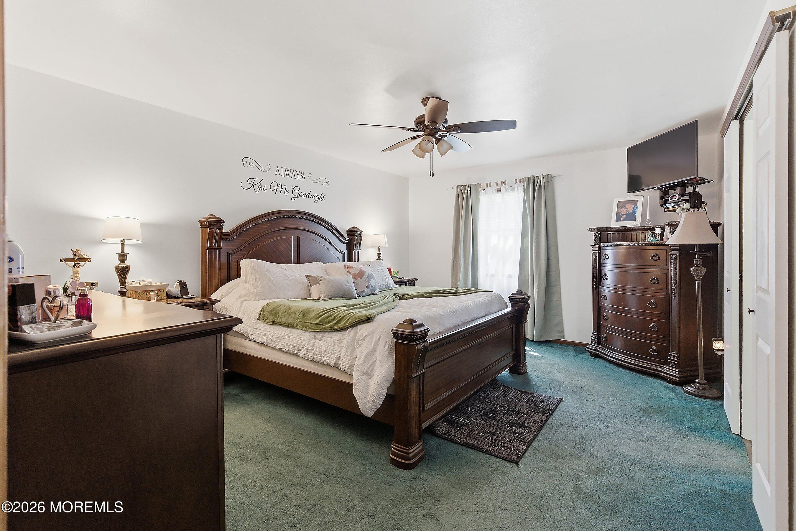 151 North Cooks Bridge Road Jackson, NJ 08527 - Photo 17 of 48 a bedroom with a bed and a chandelier