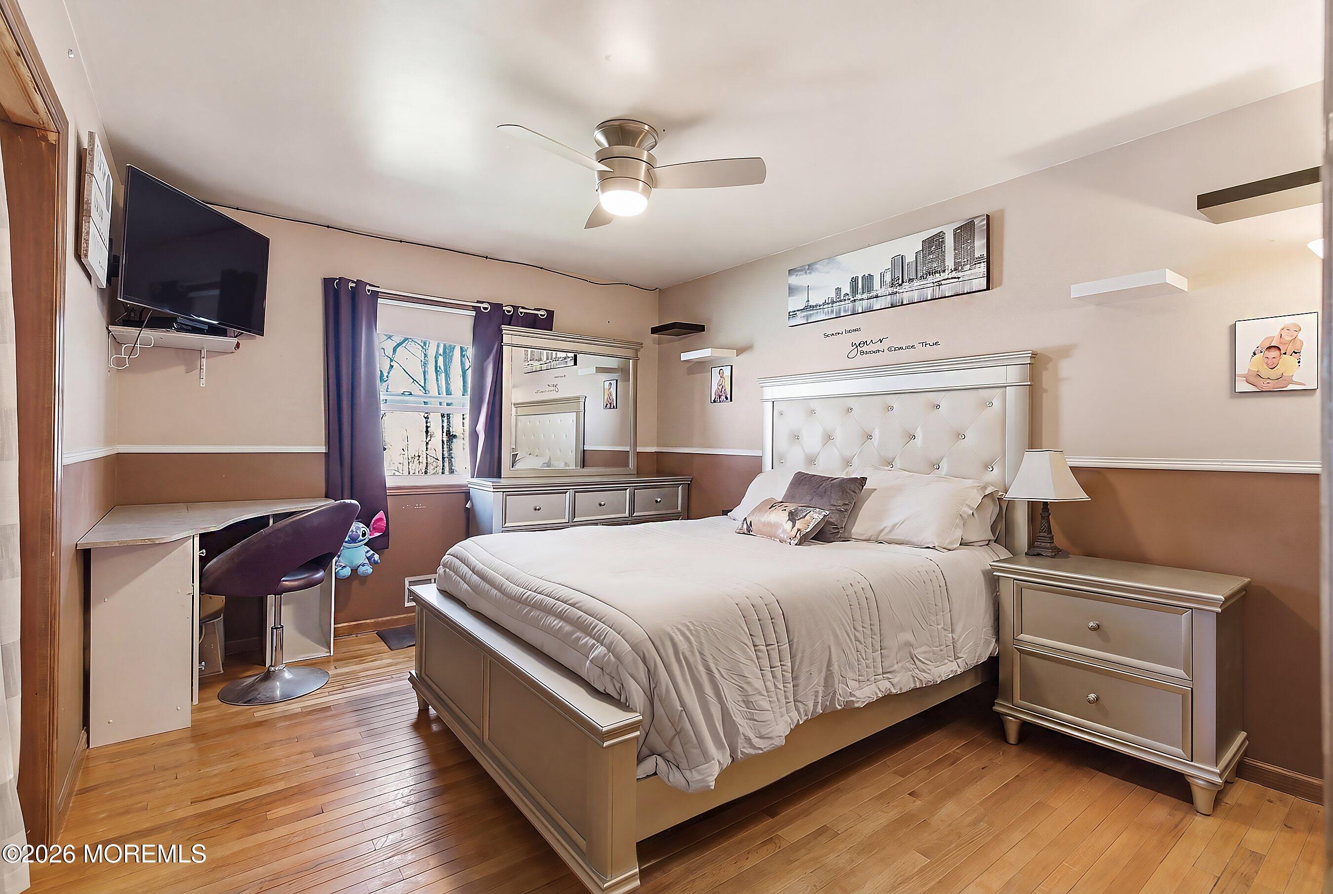 151 North Cooks Bridge Road Jackson, NJ 08527 - Photo 19 of 48 a bedroom with a bed and a flat tv screen on dresser