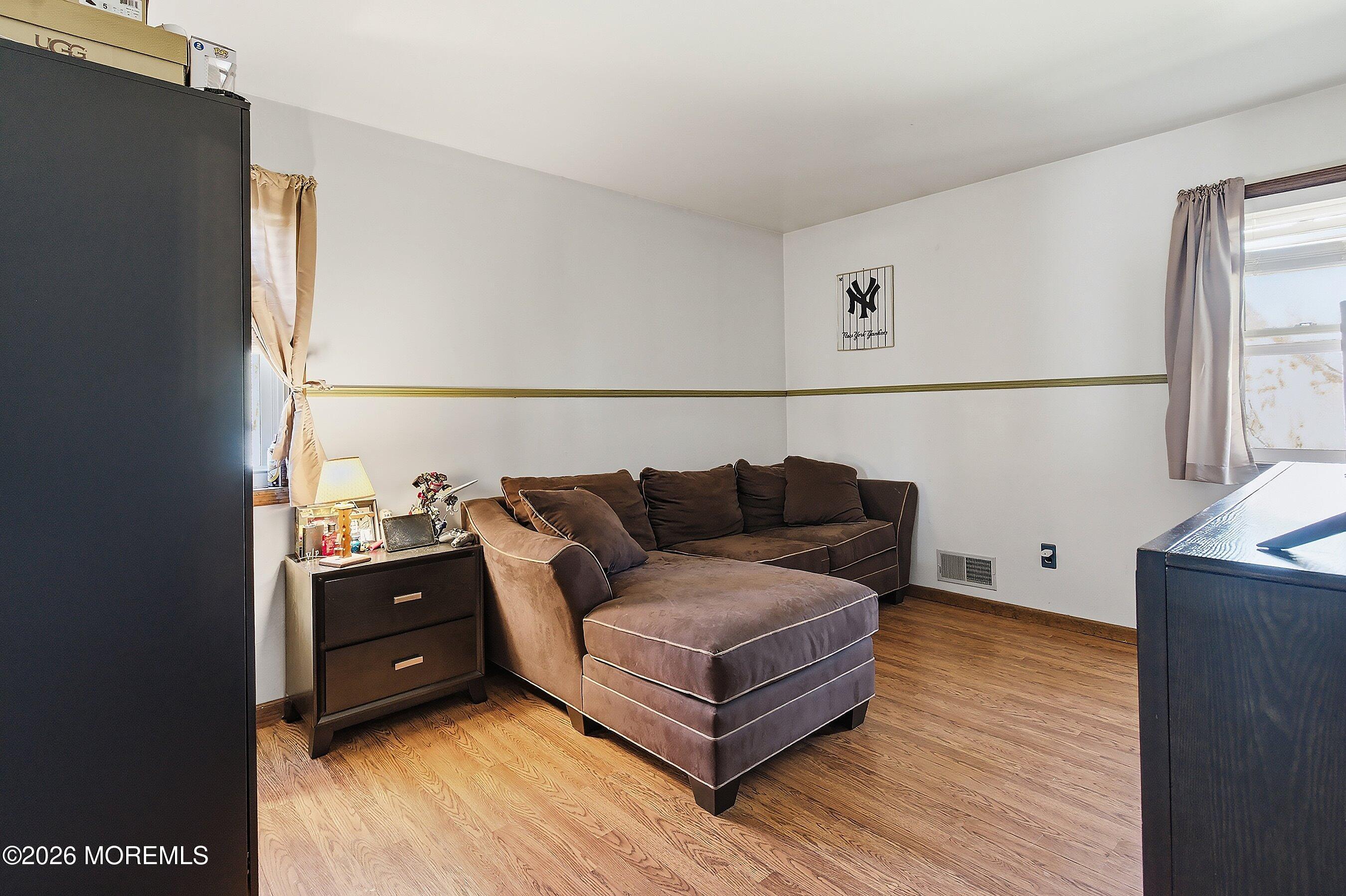 151 North Cooks Bridge Road Jackson, NJ 08527 - Photo 20 of 48 a living room with furniture and a wooden floor